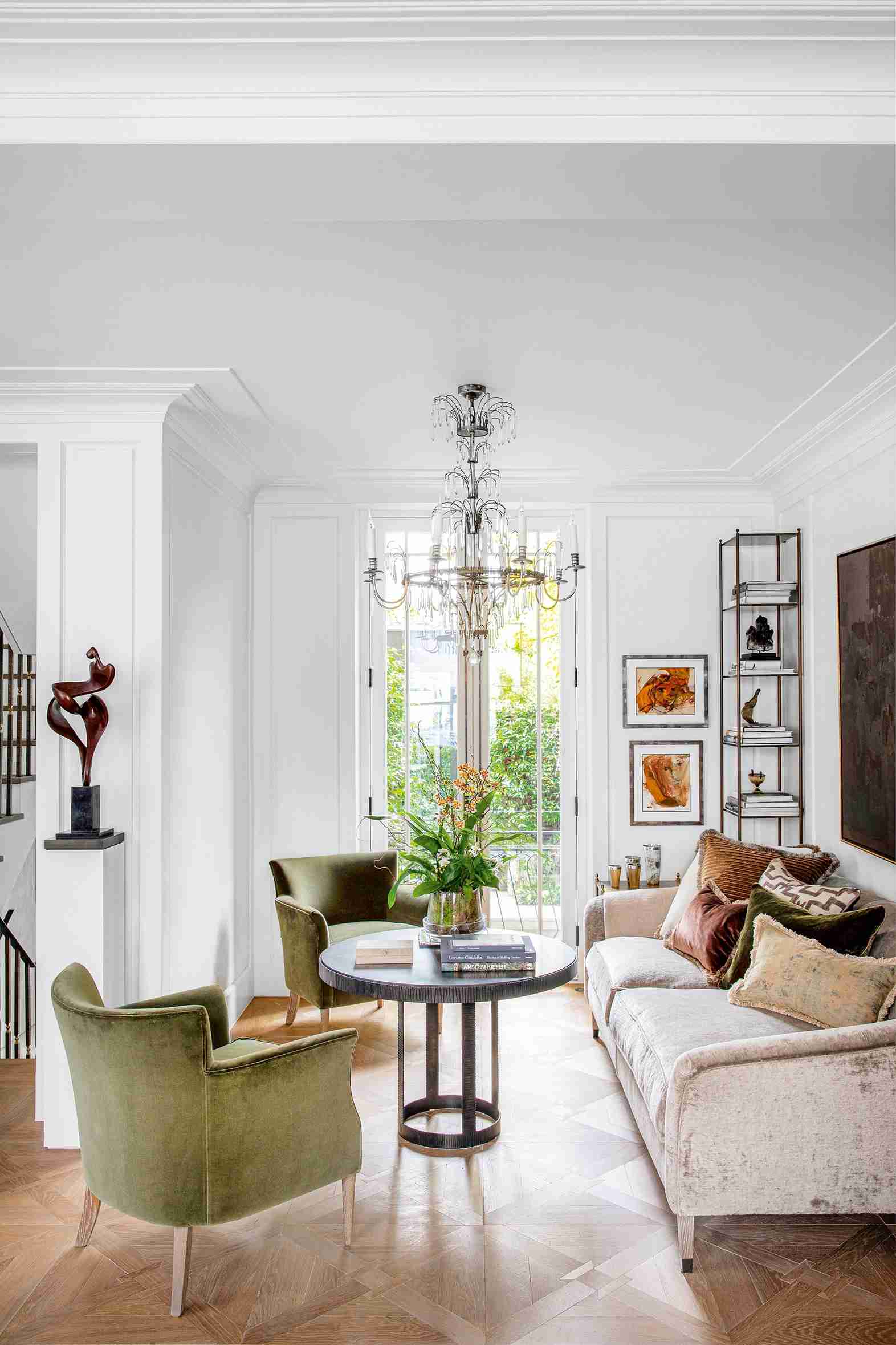 A living-room interior with geometric wood flooring, illustrating the finished surface discussed by Homes & Gardens.