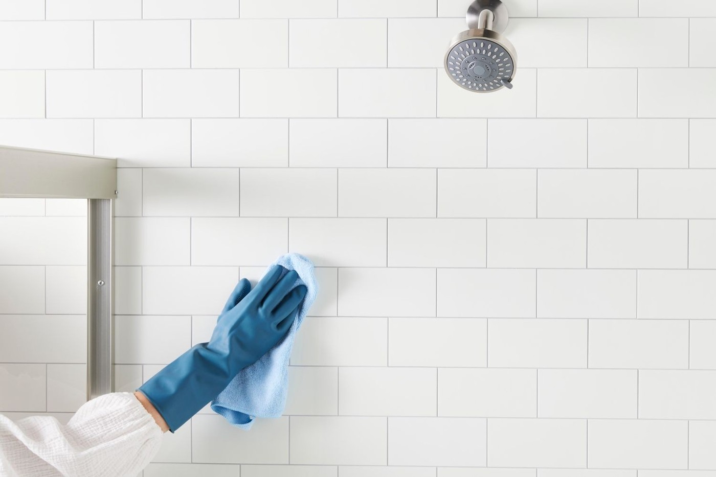 Clean Ceramic Shower Tile With Its Grout and Fixtures in Mind