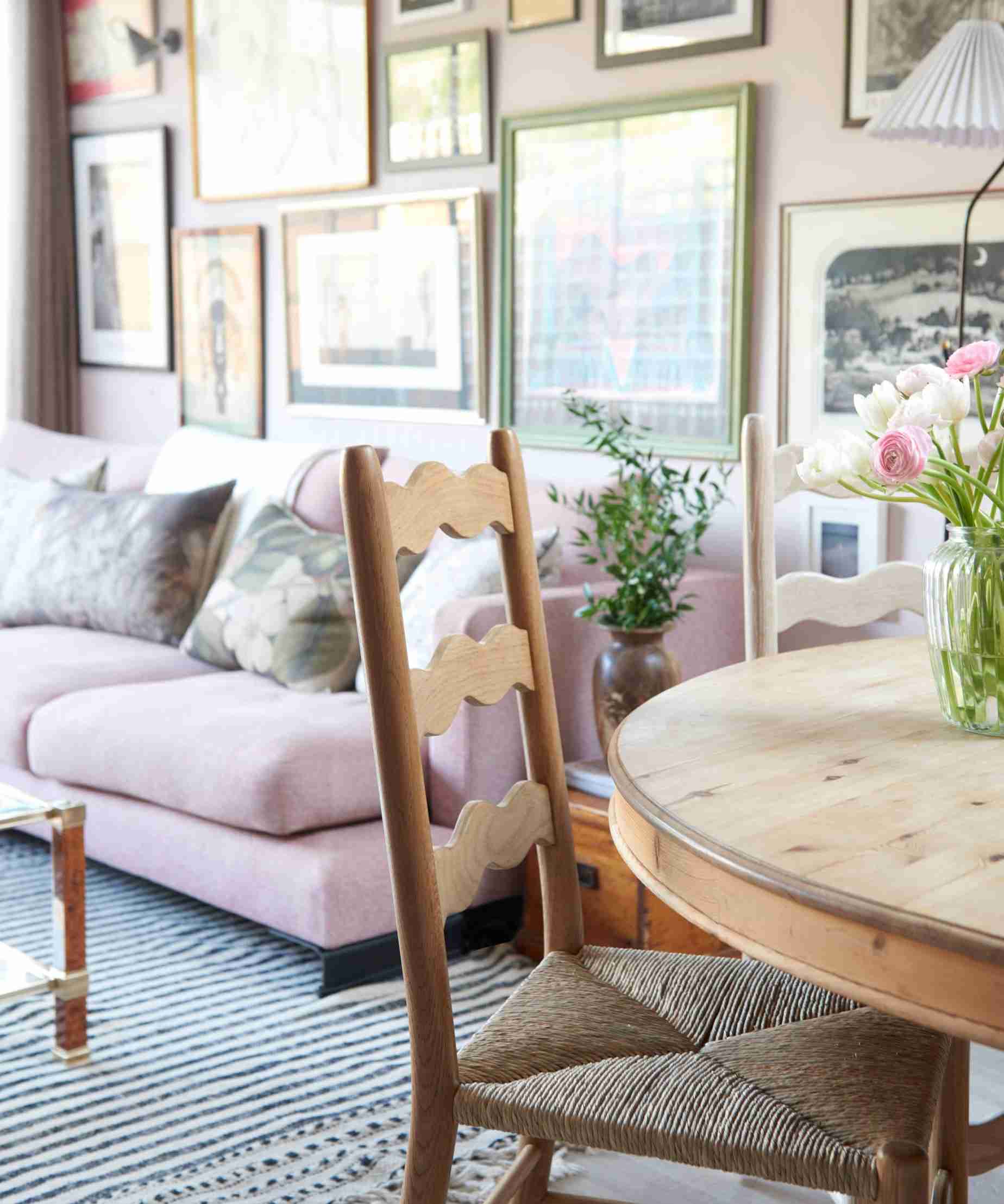 A wooden dining chair and round table beside living-room seating, illustrating the furniture-care topic in the source.